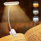 Lámpara LED de lectura con clip encendida sobre libro, 3 modos de temperatura de color